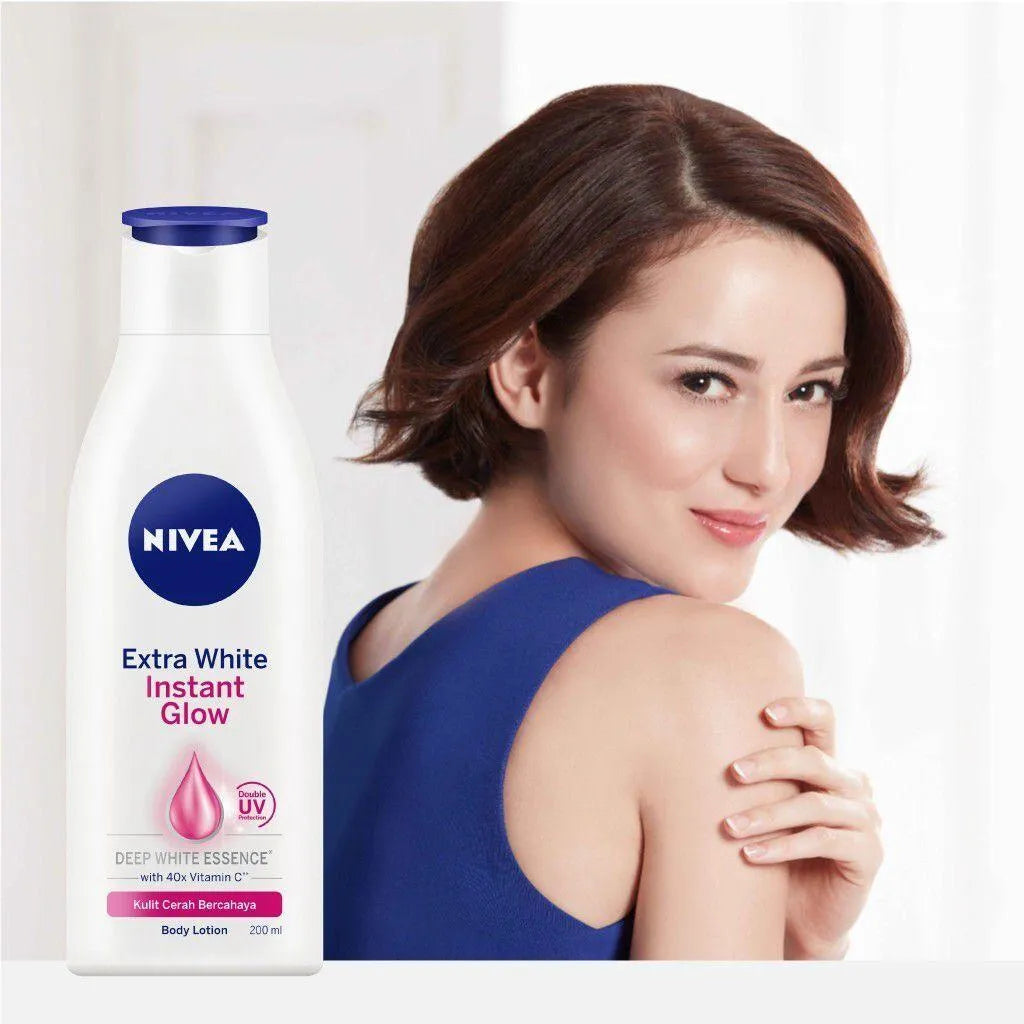 Nivea body lotion bottle with a woman in a blue dress on a white background