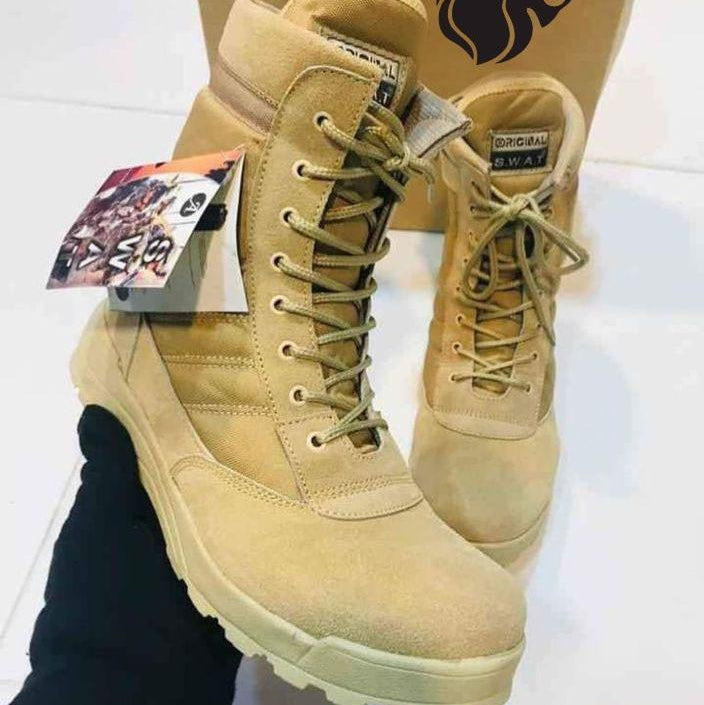 Beige boots with a brand logo in the background