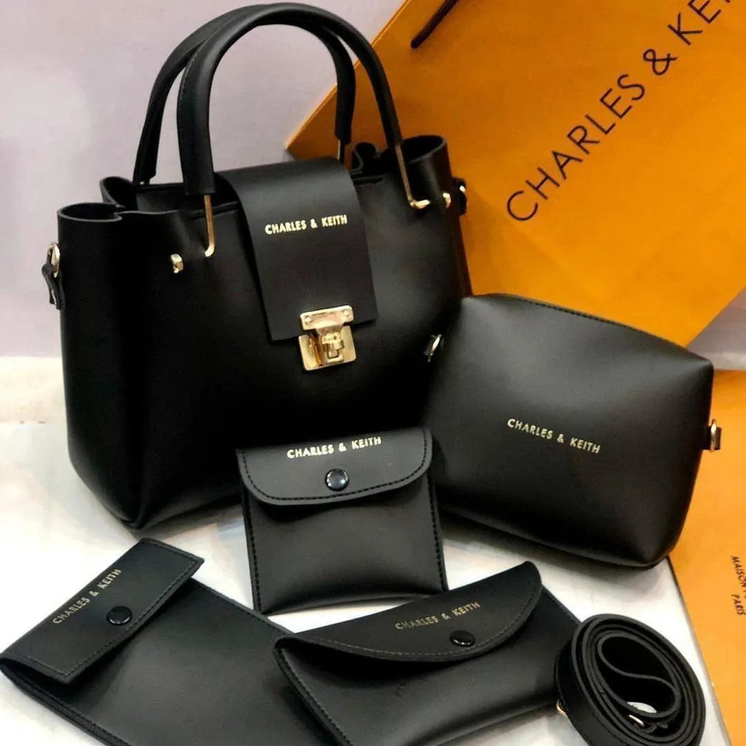 Black handbag set with accessories on a white background, featuring 'Charles & Keith' branding.