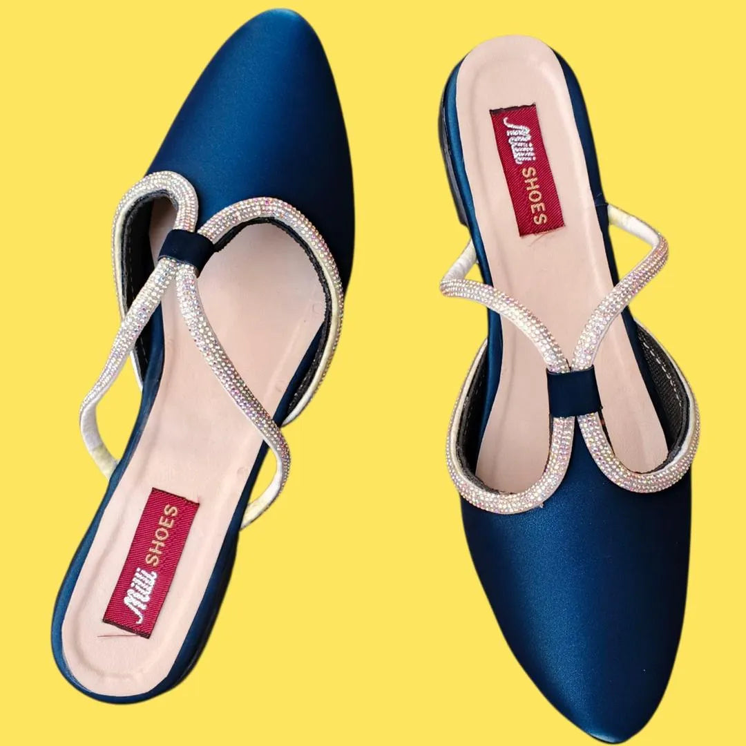 Blue shoes with decorative straps on a yellow background